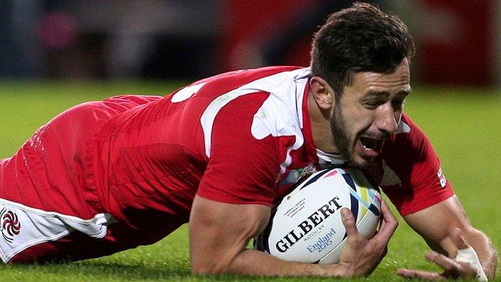 Georgia's Lasha Malaguradze scores a try against Namibia