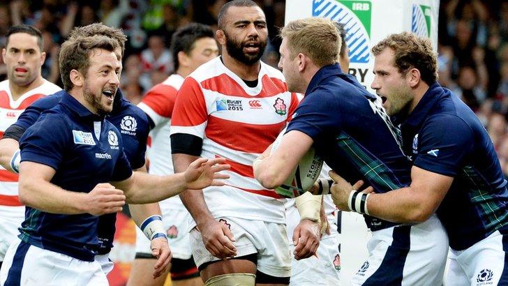 Greig Laidlaw (left) celebrates Finn Russell's try