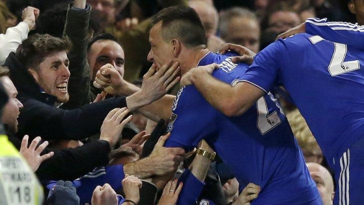 Chelsea defender John Terry celebrates his late equaliser against Everton with fans