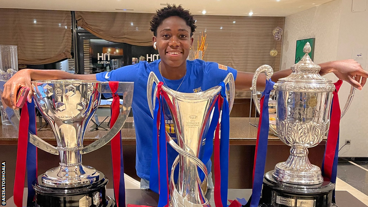 Nigeria and Barcelona striker Asisat Oshoala with the Spanish League trophy (left), the European Women's Champions League trophy (centre) and the Spanish Copa de Reina