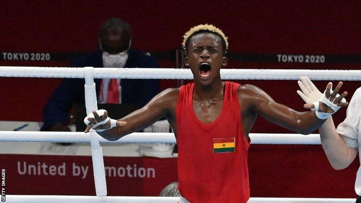 Ghanaian boxer Samuel Takyi celebrates his quarter-final win at the Tokyo Olympics