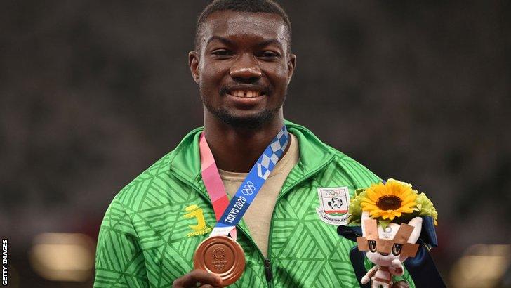 Burkina Faso's Hugues Fabrice Zango with his Olympic triple jump bronze medal