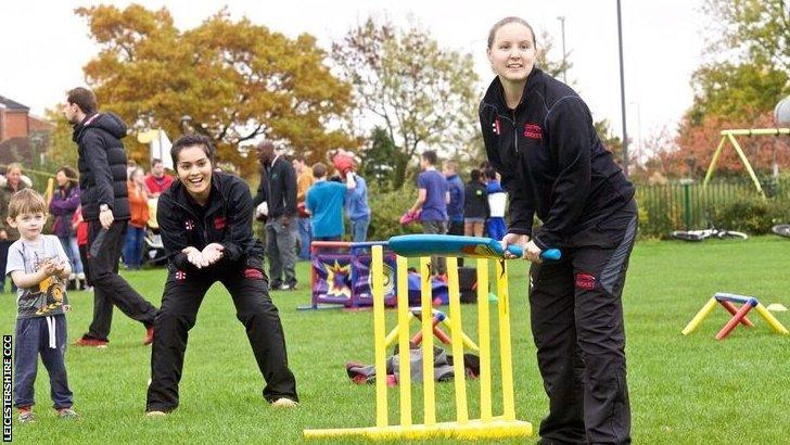 Wicketkeeper Amna Rafiq takes part in a community cricket match