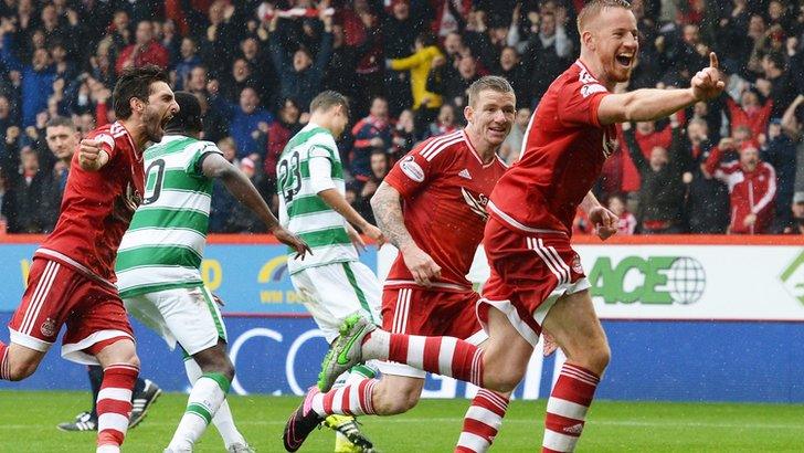 Adam Rooney celebrates his equaliser for Aberdeen