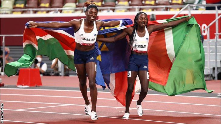 Athletes Beatrice Maslingi (left) and compatriot Christine Mboma celebrate with Namibian flags