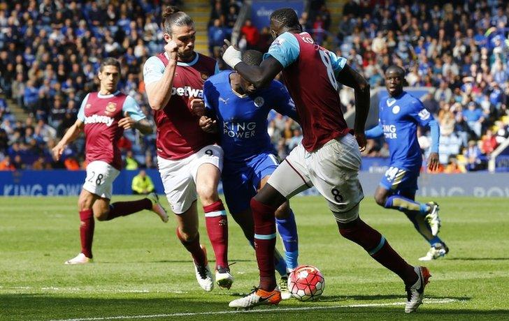 Andy Carroll challenges Jeffrey Schlupp in the incident that led to Leicester's penalty