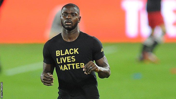 Ghana and Columbus Crew's Jonathan Mensah warming up before a match