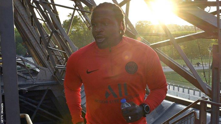 Bernard Mendy running up the stairs of the Eifel Tower