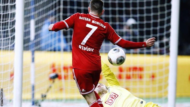 Bayern Munich player Franck Ribery scores against Hertha Berlin