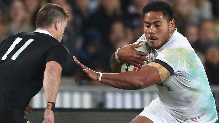 Manu Tuilagi of England takes on New Zealand's Cory Jane