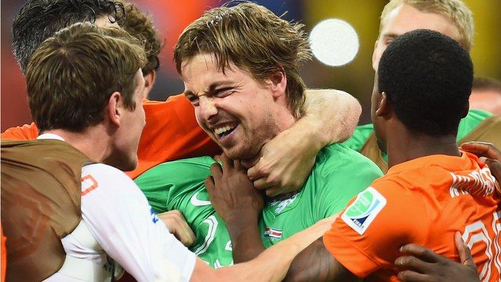 Goalkeeper Tim Krul celebrates with Netherlands team-mates after the quarter-final win over Costa Rica