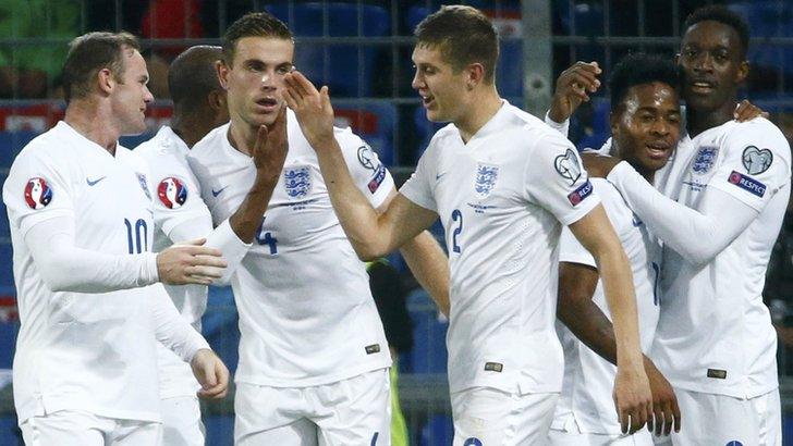 England's players celebrate after scoring against Switzerland