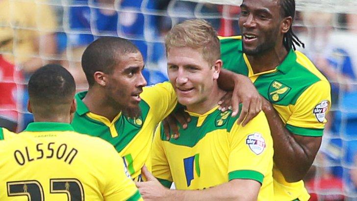 Michael Turner is congratulated after putting Norwich into the lead at Cardiff