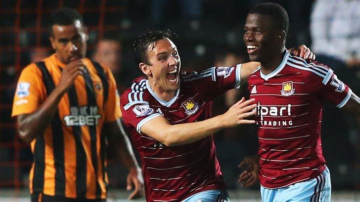 Enner Valencia celebrates his goal with West Ham team-mate Stewart Downing