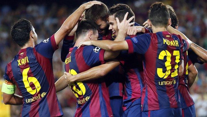 Barcelona players celebrate scoring against Apoel Nicosia in the Champions League