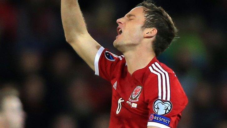 Andy King in action for Wales