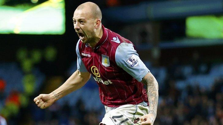 Alan Hutton celebrates after scoring for Aston Villa against Leicester City