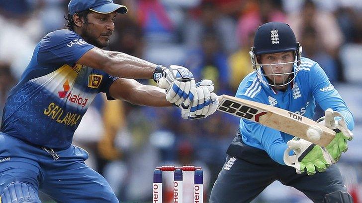 Sri Lanka's Kumar Sangakkara in action, watched by England's Jos Buttler