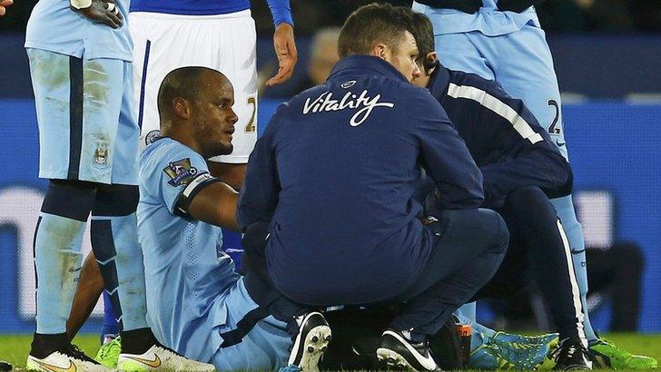 Vincent Kompany of Manchester City receives treatment