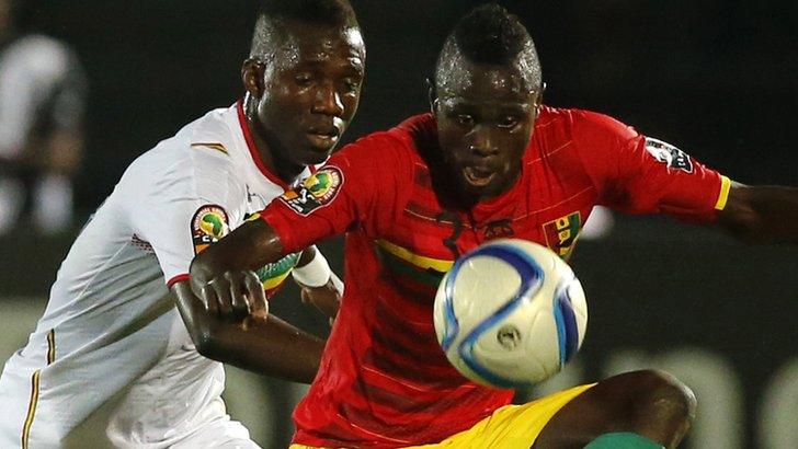 Mali's Modibo Maiga challenges Guinea's Issiaga Sylla