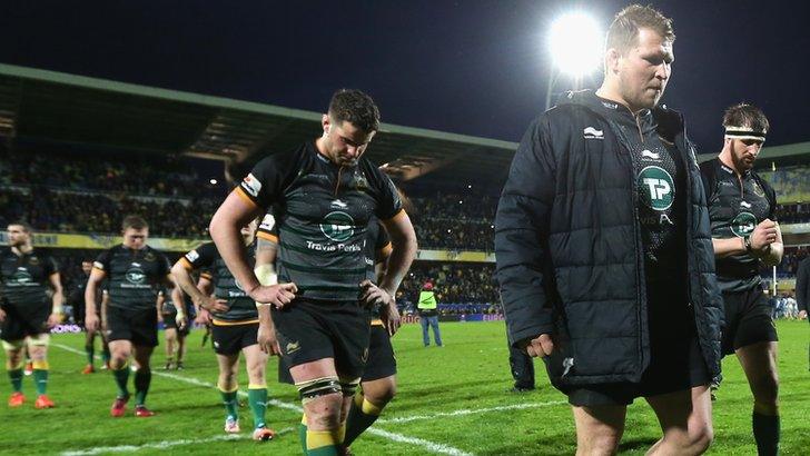 Northampton Saints captain Dylan Hartley leads his players off the pitch