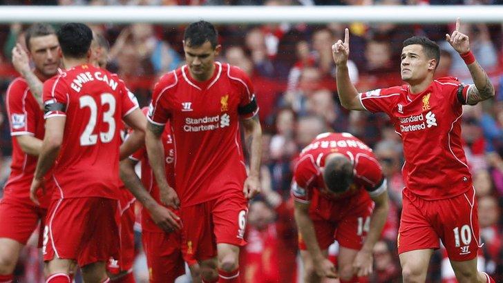 Philippe Coutinho celebrates scoring the opening goal for Liverpool