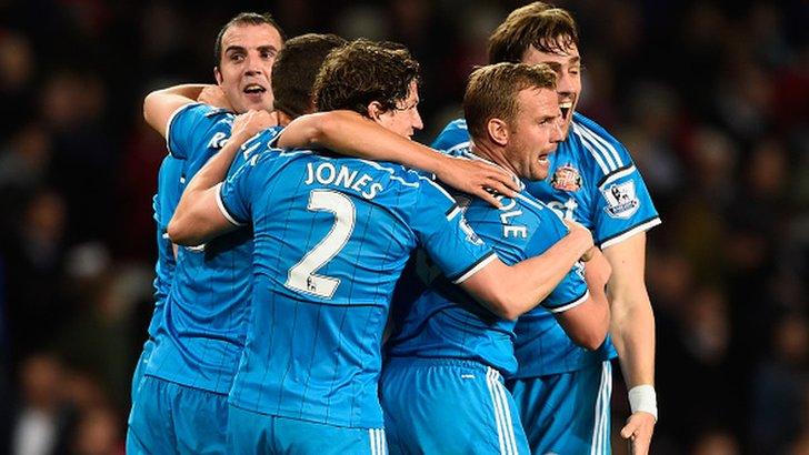 Sunderland players react after securing Premier League survival