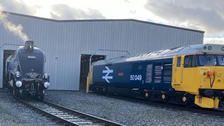 Two historic trains on show in Alstom's rail yard in Derby