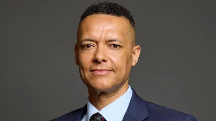 Clive Lewis wearing a suit and tie