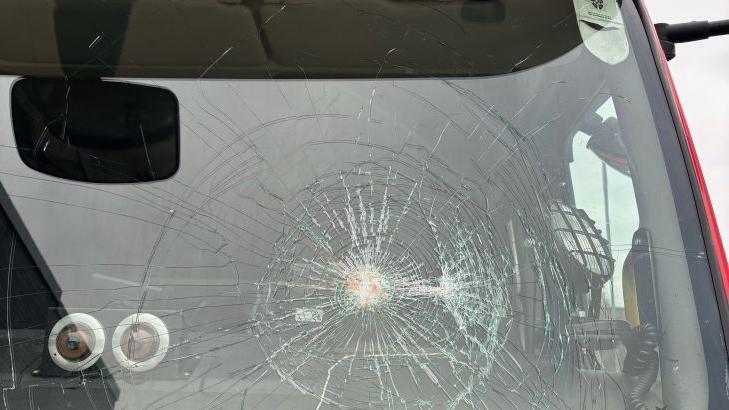 A large crack on the windscreen of a fire engine