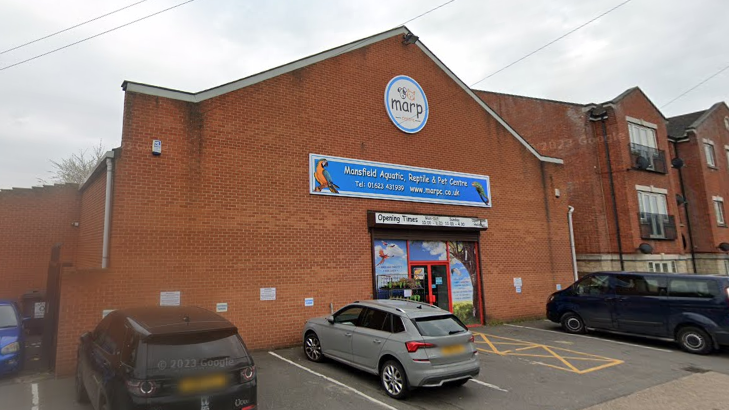 An image of the Mansfield Aquatic, Reptile and Pet Centre with cars parked outside the front of the building.