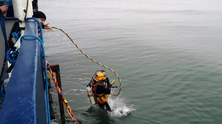 A Navy diver taking part in the recovery operation off Hook Head