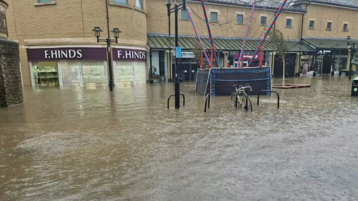 Deep floodwater covering the pedestrianised centre of Hastings, East Sussex.