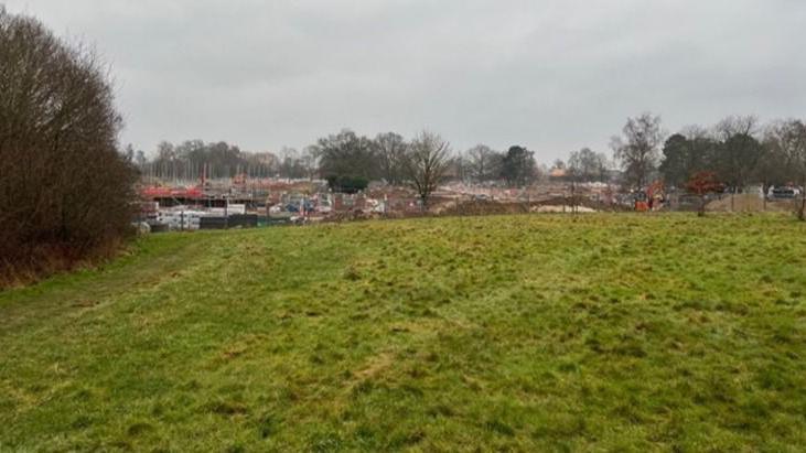 A photo within undeveloped golf course land where 70 new homes could be built, with a view towards the Emmer Green Drive development site off Kidmore End Road, Caversham