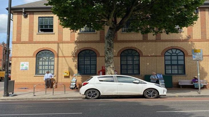 A Google street view image showing the previously disused Ministry of Justice building where the new cafe will be. It is a large sand-coloured brick building with arched windows on the ground floor. It is situated just off Gloucester Road and next to HMP Bristol. 