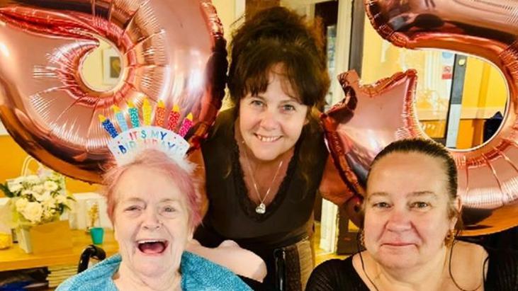 Julie Watson and Jakkie Hope with their mum Kath on her birthday