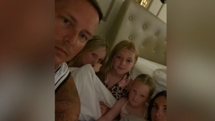 Family picture of Kyle Holmes and his wife and three children sheltering inside their hotel room as Hurricane Melissa tore across Jamaica.