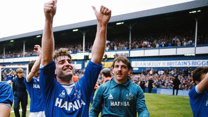 Kevin Ratcliffe celebrates Everton's First Division title win with Wales team-mate Neville Southall at Goodison Park in May 1985