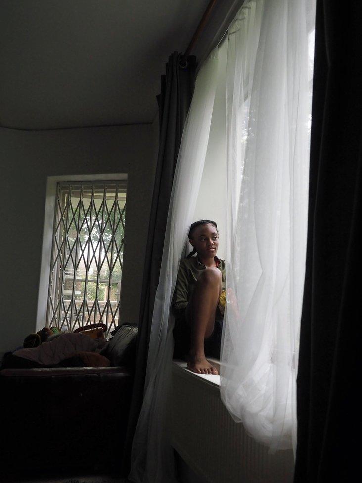 Michaela on her window ledge