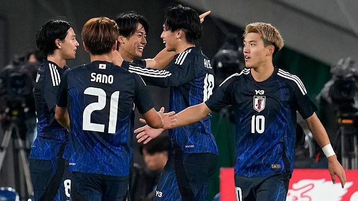 Japan celebrate a goal against Brazil