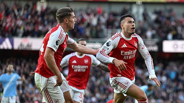 Gabriel Martinelli celebrates his 93rd minute equaliser. 