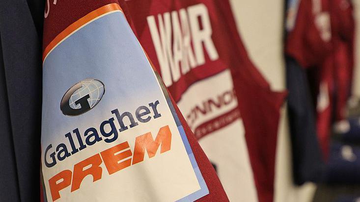 A Gallagher Prem badge on a Sale Sharks jersey hanging up before a game in October 2025