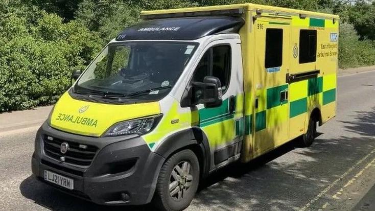 An ambulance on a rural road