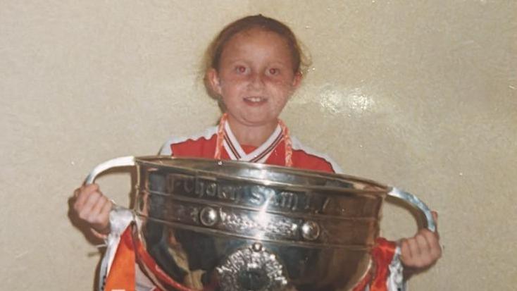 Gillian Kelly, aged 8, holding the Sam Maguire trophy in 2002