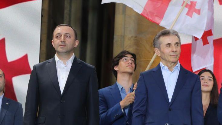 Founder and Honorary President of the Georgian Dream Party Bidzina Ivanishvili (C), and Chairman of the Georgian Dream Party Irakli Garibashvili (L) attend a protest in support of the draft law on 'Transparency of Foreign Influence,' which was presented to Parliament by the ruling Georgian Dream Party and received preliminary approval in Tbilisi, Georgia on April 29, 2024