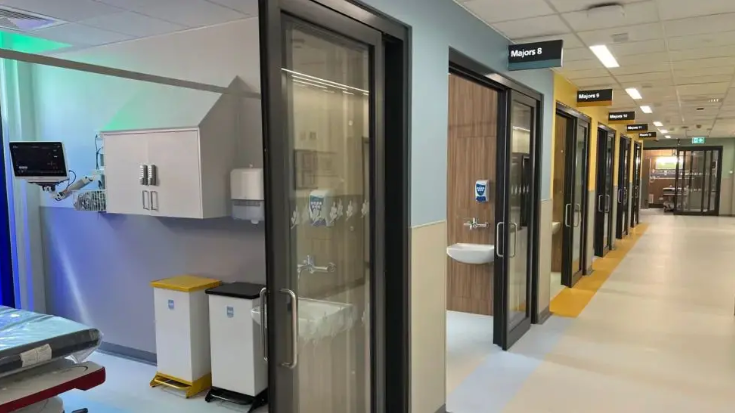 Image shows a new corridor of resuscitation cubicles, each with their own glass door at the Great Western Hospital in Swindon