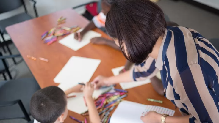 A child and teacher