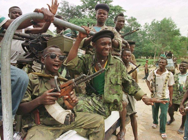 RUF ( Revolutionary United Front ) soldiers ride in a pick up truck at their base in the outskirts of Freetown Tuesday, June 10, 1997