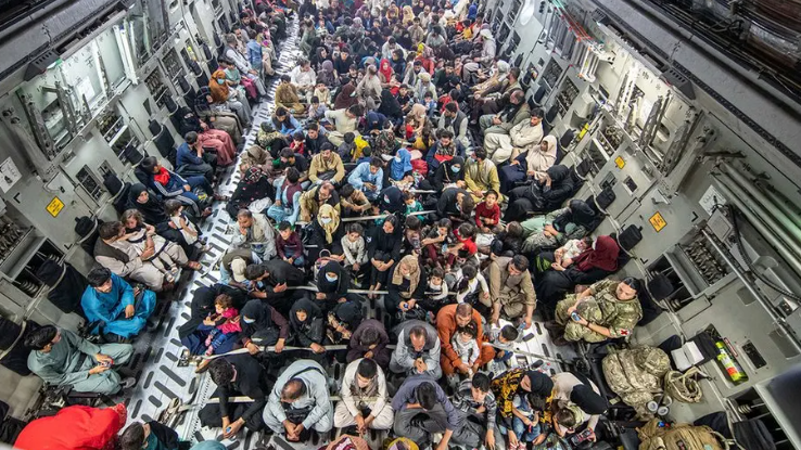 Evacuees are packed into the belly of an RAF transport plane