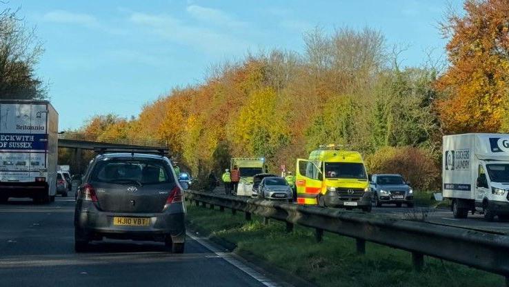 A crash on the eastbound carriageway of the A27 with two ambulances either side of two cars in one lane